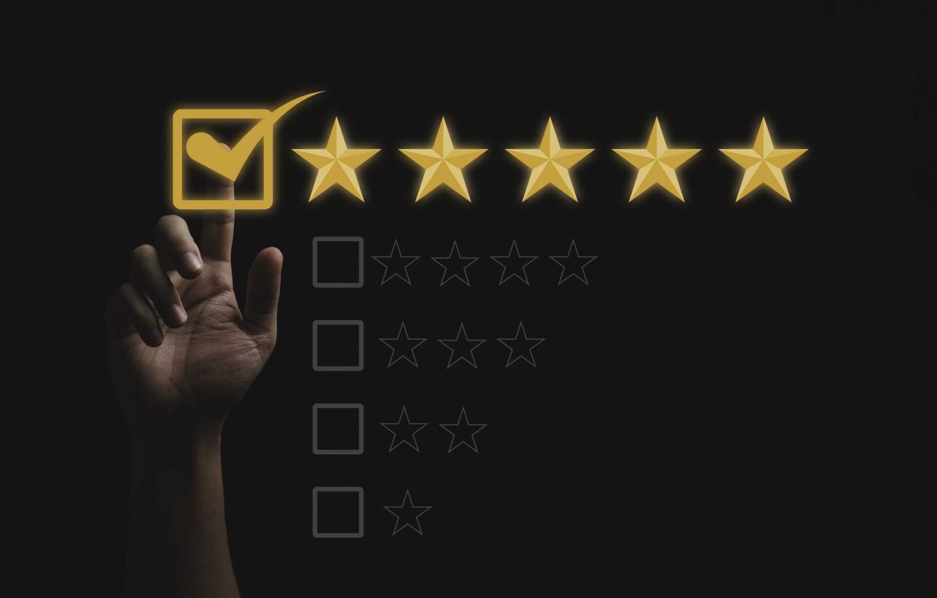 Hand touching and doing mark to five yellow stars on black backg